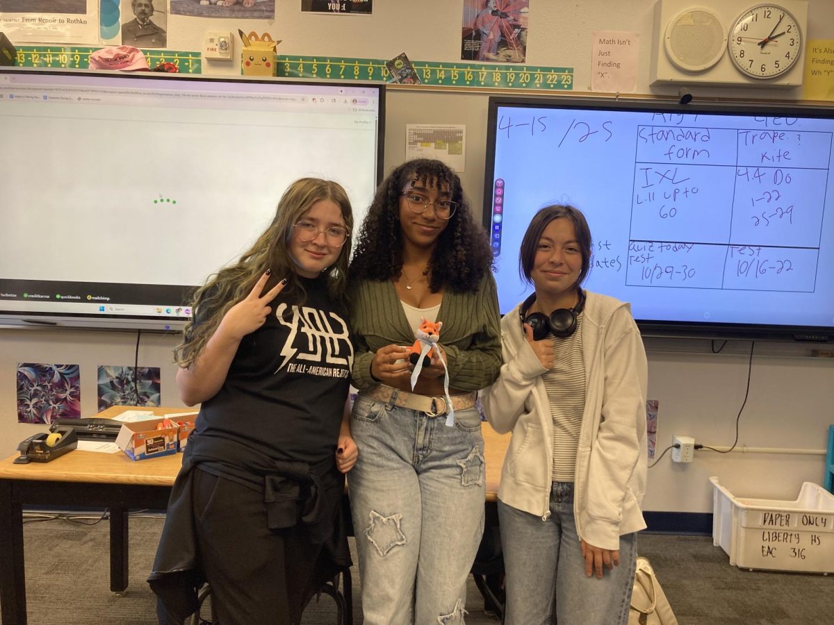 Part of the FLC’s officer board, Gabrielle Meagher (Treasurer), Alicia Cruz (Vice President/Leadership), and Nallely Velasquez (Historian)