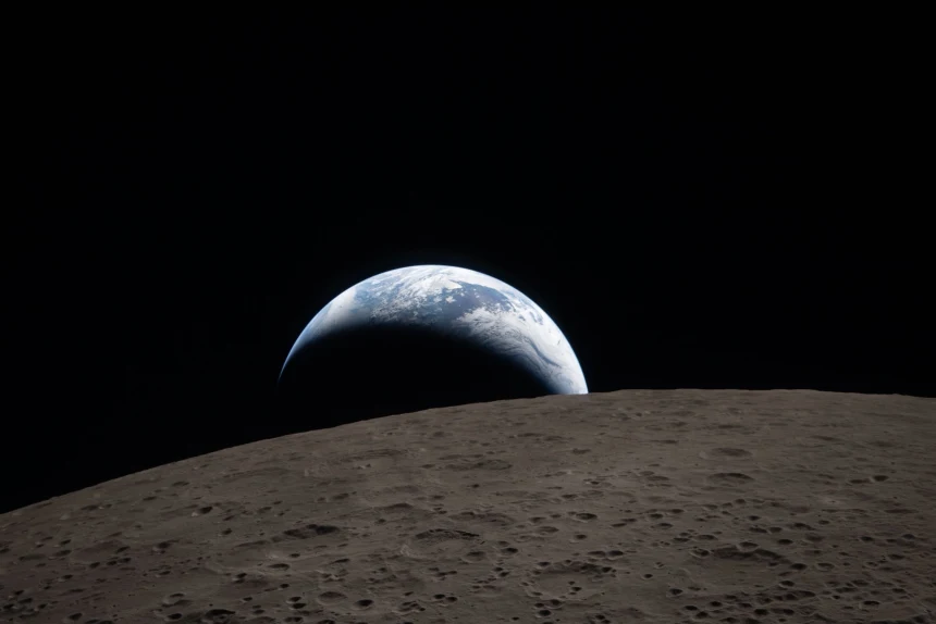 The Earth dipping beyond the lunar horizon from the far side of the Moon taken from the Orion